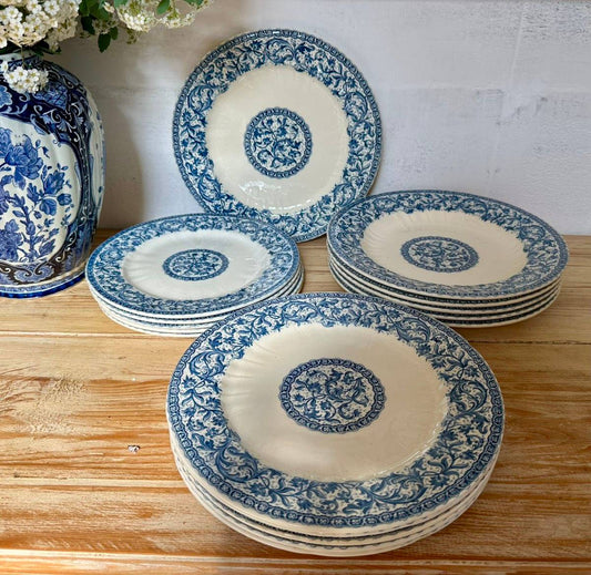 Antique Gien “Rouen” dinner plates, soup plates, and dessert plates.